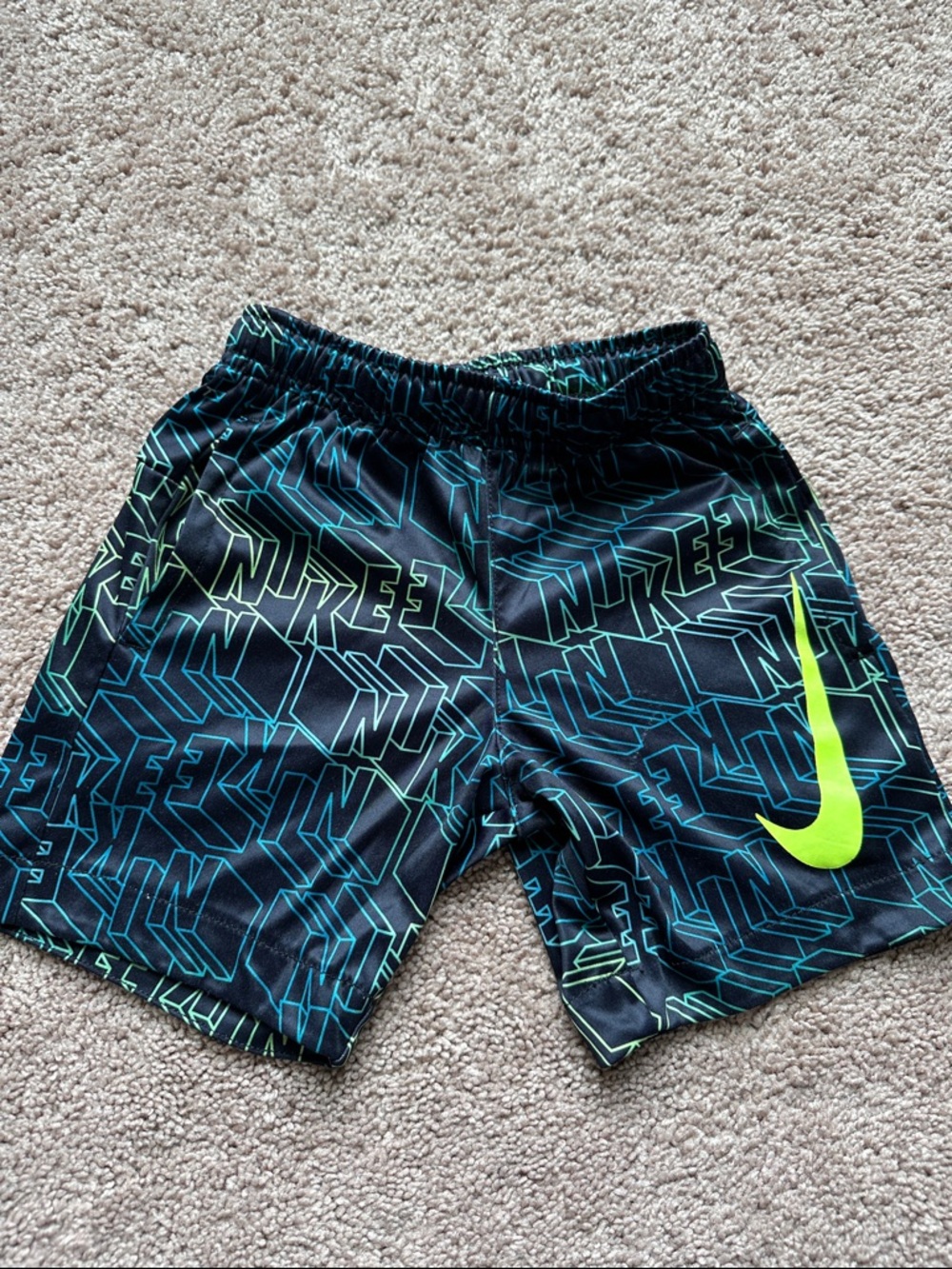 Nike Black Athletic Shorts with Neon Green Swoosh and Teal Graphic